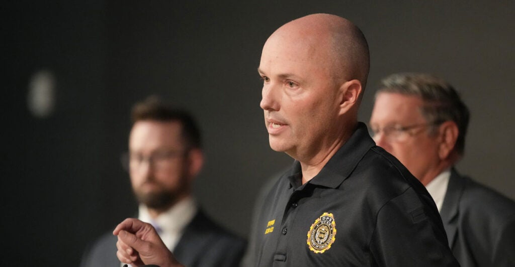 Utah Governor Spencer Cox along with other officials speaks to the press.