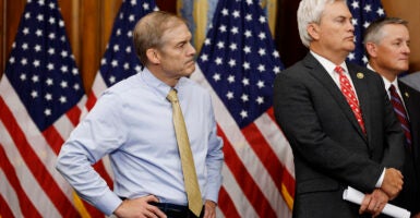 House Judiciary Committee Chairman Rep. Jim Jordan listens alongside House Oversight And Government Reform Committee Chairman Rep. James Comer at a news conference.