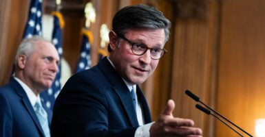 Speaker of the House Mike Johnson and House Majority Leader Steve Scalise (background), both R-La.