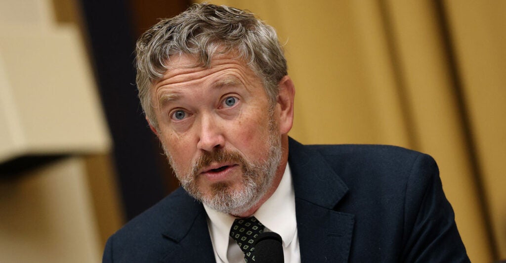 Close-up of Thomas Massie in a congressional hearing.