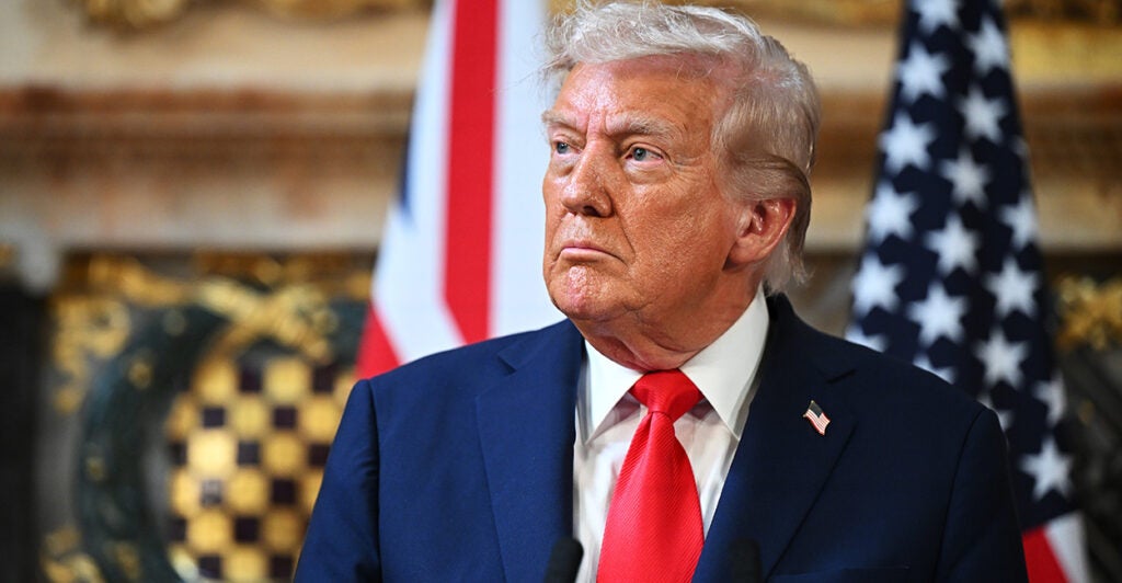 A resolute-looking Donald Trump looks off to his right.