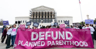 Pro-lifers demonstrate in front of the Supreme Court on April 2.