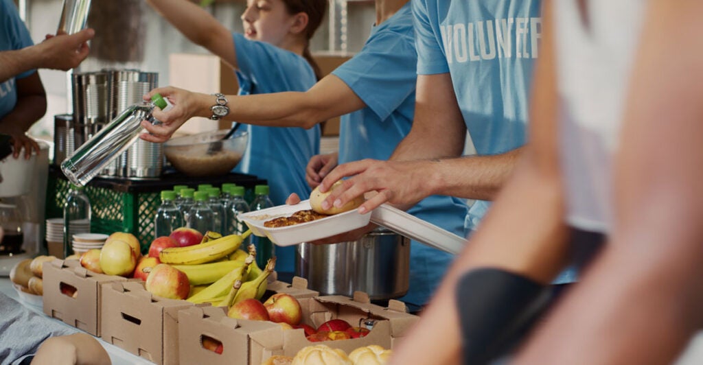 People distributing food to the needy