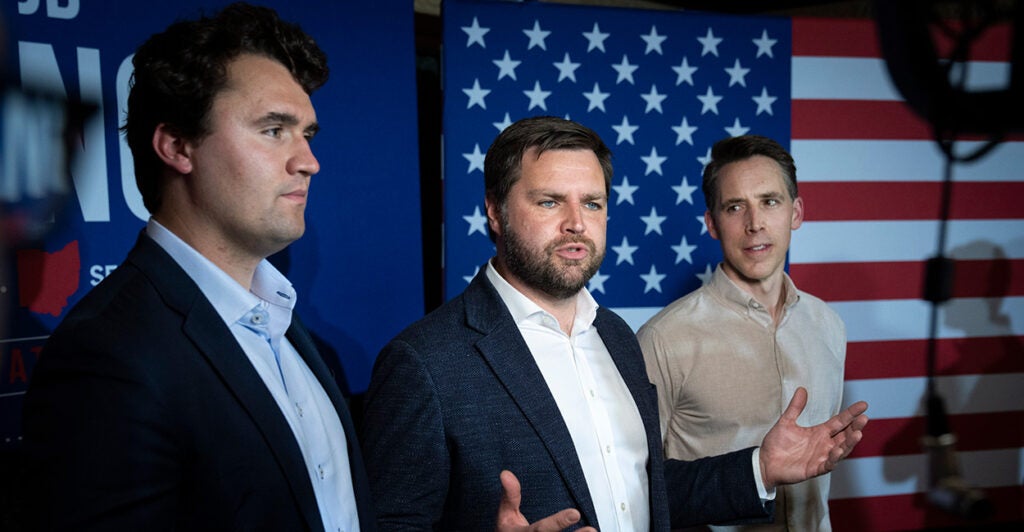 From left: Charlie Kirk; then-Sen. JD Vance, R-Ohio; and Sen. Josh Hawley, R-Mo., at a campaign event in 2022.