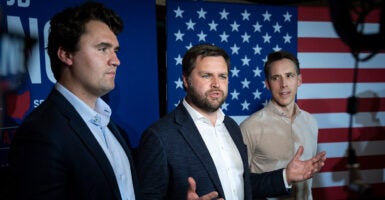 From left: Charlie Kirk; then-Sen. JD Vance, R-Ohio; and Sen. Josh Hawley, R-Mo., at a campaign event in 2022.