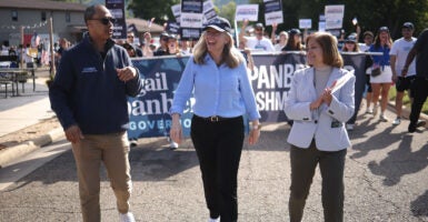 Virginia Democratic gubernatorial candidate Abigail Spanberger (center) marches in the annual Labor Day festival parade with the Democrat nominee for lieutenant governor, state Sen. Ghazala Hashmi (right), and Democrat nominee for attorney general Jay Jones on Sept. 1 in Buena Vista, Va.