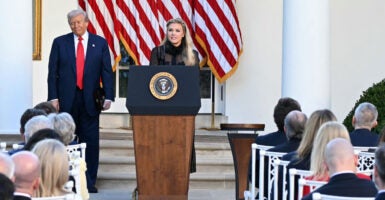 President Donald Trump and Erika Kirk, Charlie Kirk's widow, participate in a Presidential Medal of Freedom ceremony honoring the late conservative activist in the Rose Garden of the White House on Tuesday.