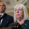 With Sen. Cory Booker, D-N.J., looking on, Sen. Patty Murray, D-Wash., speaks at a press conference at the Capitol on Oct. 15.