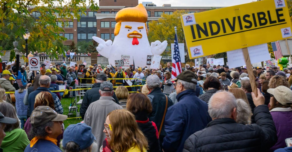 What appears to be a giant inflatable chicken made up to represent President Donald Trump serves as a prop at a "No Kings" protest on Oct. 18 in Saratoga, N.Y.