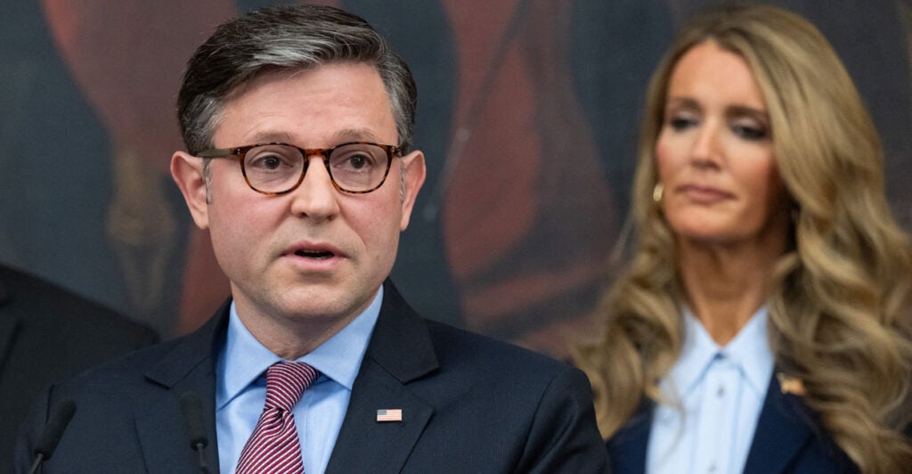 With Kelly Loeffler, head of the Small Business Administration, looking on, House Speaker Mike Johnson, R-La., speaks at a Monday news conference at the Capitol on the federal government shutdown, now in its 27th day.