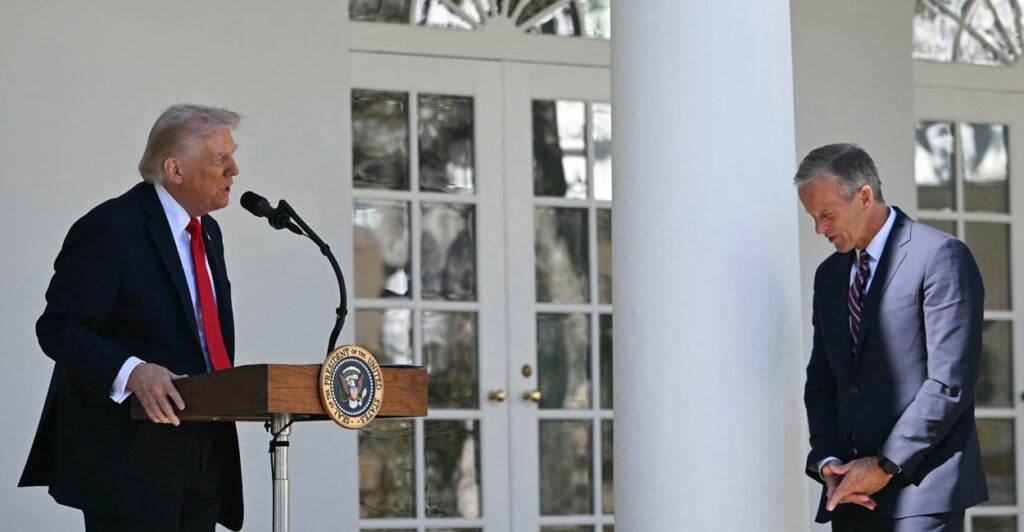 President Donald Trump introduces Senate Majority Leader John Thune, R-S.D., at a "Rose Garden Club" lunch at the White House on Oct. 21.