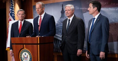 Senate Majority Leader John Thune, R-S.D., speaks at a press conference Wednesday, flanked by Republican Sens. John Barrasso of Wyoming (left); John Hoeven of North Dakota (center right); and Bernie Moreno of Ohio.