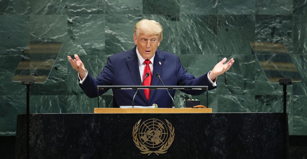 Donald Trump, arms outstretched, addresses the U.N. General Assembly.