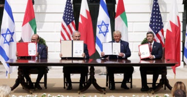 Against a backdrops from the four nations involved, Foreign Affairs Minister of Bahrain Abdullatif bin Rashid Al Zayani; Prime Minister of Israel Benjamin Netanyahu; President Donald Trump; and Foreign Affairs Minister of the United Arab Emirates Abdullah bin Zayed bin Sultan Al Nahyan participate in the signing ceremony of the Abraham Accords on the South Lawn of the White House on Sept. 15, 2020.