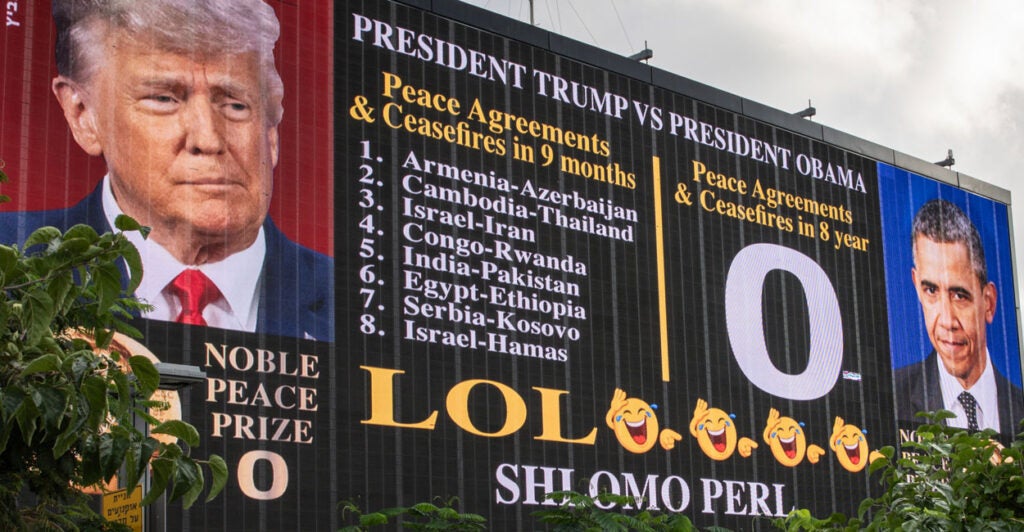A billboard listing President Trump's many accomplishments compared to President Obama's zero accomplishments.