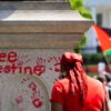 Mock bloody handprints sully a statue's pedestal in Lafayette Park in Washington as pro-Palestinian demonstrators protest on June 8, 2024.