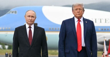 President Donald Trump and Russian President Vladimir Putin pose on the tarmac after arrival at Joint Base Elmendorf-Richardson in Anchorage, Alaska, on Aug. 15.