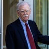 John Bolton exiting a courthouse.