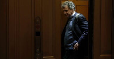 Former Sen. Sherrod Brown stands in an elevator.