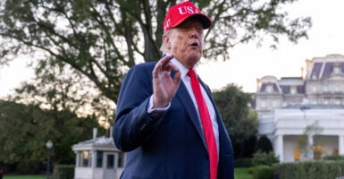 President Donald Trump, wearing a red tie and matching 