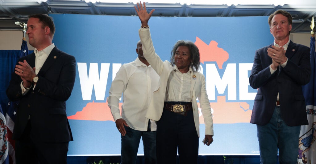 Virginia Attorney General Jason Miyares and Gov. Glenn Youngkin flank Lt. Gov. Winsome Earle-Sears at a campaign event.