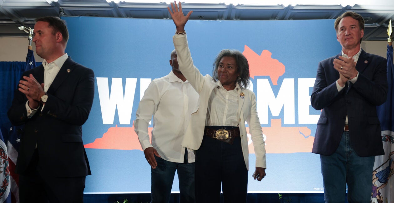 Virginia Attorney General Jason Miyares and Gov. Glenn Youngkin flank Lt. Gov. Winsome Earle-Sears at a campaign event.