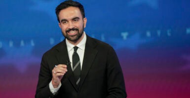 Democratic mayoral nominee Zohran Mamdani speaks during a mayoral debate at Rockefeller Center, looking directly at the camera.