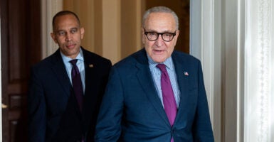 House Minority Leader Hakeem Jeffries (left) and Senate Minority Leader Chuck Schumer, both D-N.Y., walk through the Capitol.