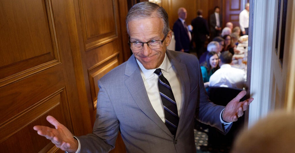 Senate Majority Leader John Thune speaks to reporters in the capitol.