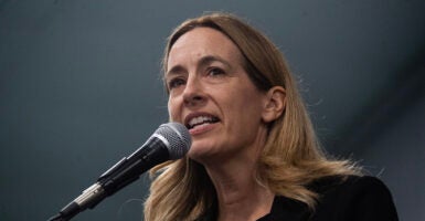 New Jersey governor candidate Mikie Sherrill speaks at a microphone. The New Jersey Education Association, which backed her, will host a drag queen event two days after the election.