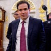 Secretary of State Marco Rubio walks though the Oval Office.