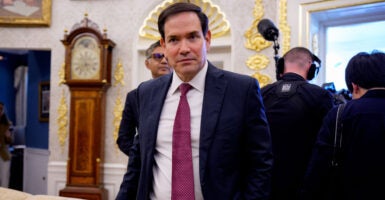 Secretary of State Marco Rubio walks though the Oval Office.