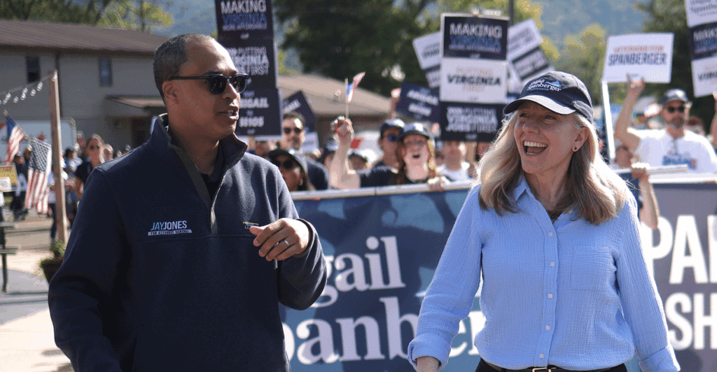 Jay Jones and Abigail Spanberger leading a parade.