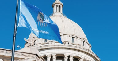 State Flag flying at the Historic Oklahoma State Capitol building in Oklahoma City