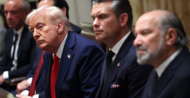 President Donald Trump presides Thursday over a Cabinet meeting, along with War Secretary Pete Hegseth (center) and Commerce Secretary Howard Lutnick.