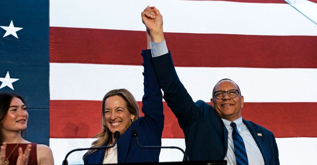 New Jersey Democratic gubernatorial candidate Mikie Sherrill celebrates with her lieutenant governor running mate, Dale Caldwell, after their election victory Tuesday night in East Brunswick, N.J.