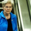 Sen. Elizabeth Warren, D-Mass., steps off a down escalator at the Capitol.