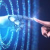 A graphic showing a human finger reaching out to touch a robotic finger emerging from rings of blue light.