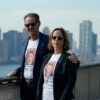 Ronen and Orna Neutra, parents of Omer Neutra, pose with the New York skyline behind them.