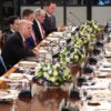 President Trump sits at the center of a long dinner table with Central Asian leaders.