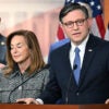 Speaker Mike Johnson at a podium, speaking to reporters.