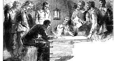 An etching of the signing of the Mayflower Compact.