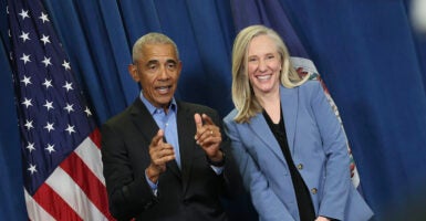 Barack Obama and Abigail Spanberger pose for a photo. Before they spoke, Jay Jones appeared at their rally, tying the Democrats to Jones' politically violent rhetoric.