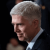 U.S. Supreme Court Associate Justice Neil M. Gorsuch waits for former U.S. President George H.W. Bush at the U.S Capitol December 03, 2018