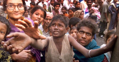"Climate colonialism" wants to keep the poor, like these starving people in Calcutta, India, in poverty, E. Calvin Beisner of the Cornwall Alliance warns.