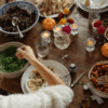Teenage girl having food while sitting at dining table during Thanksgiving