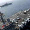 The Nimitz-class aircraft carrier USS Abraham Lincoln (CVN 72) and the Wasp-class Amphibious Assault Ship USS Kearsarge (LHD 3) sail alongside.