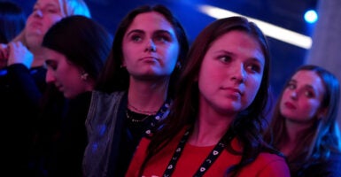 People watch from the crowd during America Fest