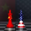 Two chess pieces sit on a chess board. One looks like the China flag and the other looks like the USA flag.