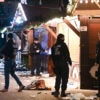 Police investigate in the aftermath of a terrorist attack on a German Christmas market.